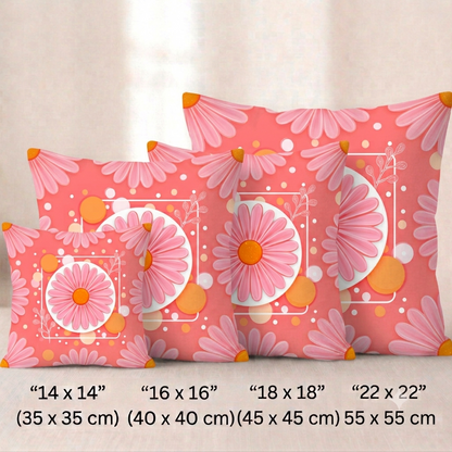 Vier quadratische Baumwoll-Kissenbezüge in kräftigem Korallenrot vor einem hellen Hintergrund. Das Design zeigt in der Mitte eine große, stilisierte rosa Blüte mit einer orangefarbenen Mitte, die auf einer weißen Kreisscheibe platziert ist. Die Blüte ist von einem weißen, quadratischen Rahmen umgeben, der mit feinen Linienzeichnungen von Zweigen, orangefarbenen Kreisen und kleinen weißen Punkten verziert ist.