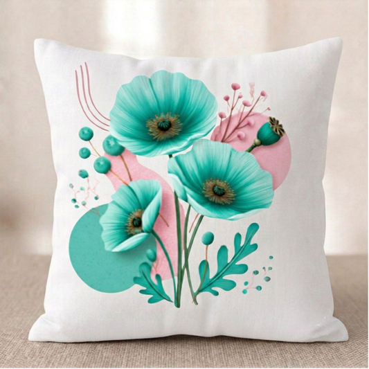 Ein quadratischer Baumwoll Kissenbezug mit modernem Mohnblumen-Design vor hellem Hintergrund. Das Motiv zeigt ein Arrangement aus drei großen, strahlend türkisfarbenen Mohnblüten mit dunkel-goldenen Zentren. Die Blüten sind umgeben von türkisen Knospen, zarten rosa Zweigen und auffälligen, teal-grünen Farnblättern. Der cremefarbene Hintergrund ist mit abstrakten rosa und türkisen Kreisen, feinen goldenen Linienbögen und Glitzerpunkten gestaltet.