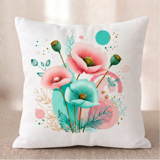 Ein quadratischer Baumwoll - Kissenbezug mit modernem Mohnblumen-Muster vor einem hellen Hintergrund. Das Design zeigt ein kunstvolles Arrangement aus rosa und türkisfarbenen Mohnblüten, grünen Kapseln, feinen goldenen Blätter-Linienzeichnungen und abstrakten Kreisen in Türkis und Rosa auf cremefarbenem Grund.