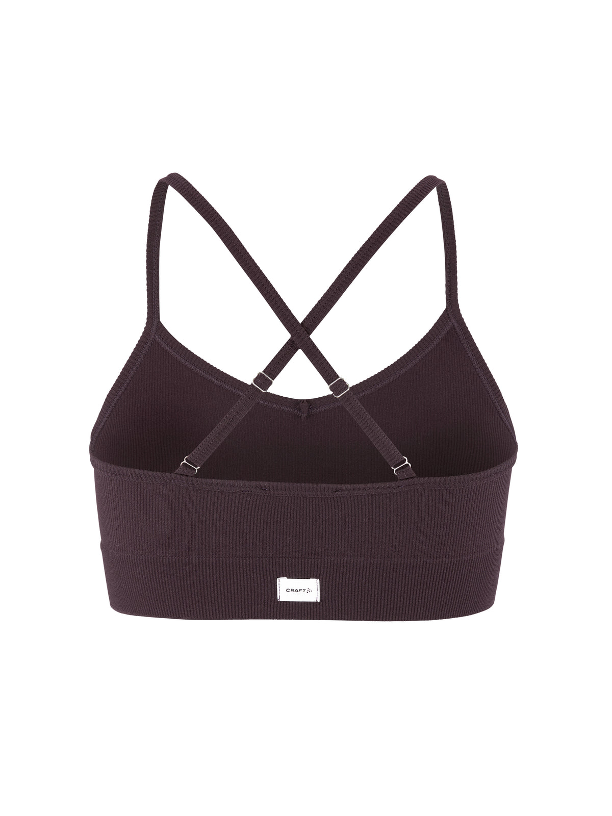 Eng anliegender Sport-BH  in der Farbe dunkle Pflaume aus geripptem Material mit schmalen Trägern, V-förmigem Ausschnitt und breitem, elastischem Unterbrustband.