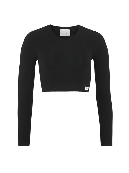 Kurz geschnittenes, körpernahes Langarmtop  in der Farbe schwarz aus geripptem Material mit rundem Halsausschnitt, langen schmalen Ärmeln und geradem Saum.