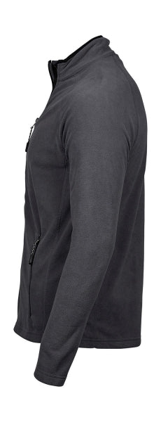 Dunkelgraue Fleecejacke mit körpernahem, geradem Schnitt und leicht strukturierter Oberfläche. Die hüftlange Jacke hat einen aufgestellten Kragen, schmale lange Ärmel und zwei seitliche Reißverschlusstaschen. Dezente dunkle Einfassungen an Kragen, Reißverschluss und Taschen unterstreichen das schlichte, sportliche Design.
