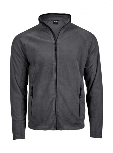 Dunkelgraue Fleecejacke mit körpernahem, geradem Schnitt und leicht strukturierter Oberfläche. Die hüftlange Jacke hat einen aufgestellten Kragen, schmale lange Ärmel und zwei seitliche Reißverschlusstaschen. Dezente dunkle Einfassungen an Kragen, Reißverschluss und Taschen unterstreichen das schlichte, sportliche Design.
