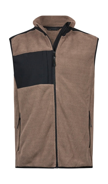 Mountain Fleece Bodywarmer in Clay/Black mit schwarzem Reißverschluss und dunklen Kontrastbesätzen an Brust und Schultern. Die hüftlange Weste ist körpernah geschnitten, hat einen hohen Kragen und seitliche Reißverschlusstaschen.