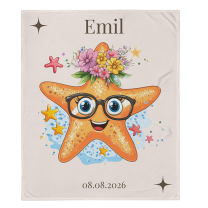Kuscheldecke Robby mit orangefarbenem Seestern, schwarzer Brille, blauen Augen und buntem Blumenkranz