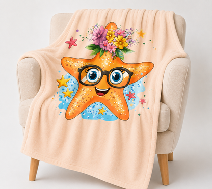 Kuscheldecke Robby mit orangefarbenem Seestern, schwarzer Brille, blauen Augen und buntem Blumenkranz