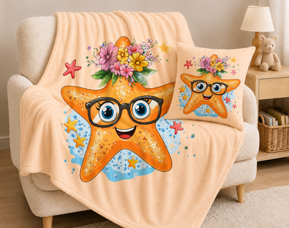 Kuscheldecke Robby mit orangefarbenem Seestern, schwarzer Brille, blauen Augen und buntem Blumenkranz